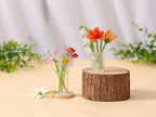 Mundgeblasene Glasblumen, glänzend, durchscheinend, mit Farbverläufen, einzelne Stiele, perfekt zur Dekoration von Wohnräumen.