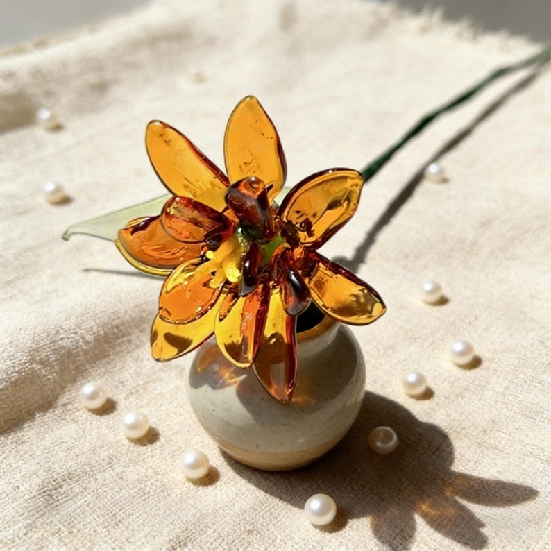 Mundgeblasene Glasringelblume, 20 cm, bernsteinfarben